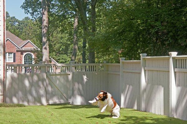 White privacy fence designed and built by Atlanta Decking & Fence.