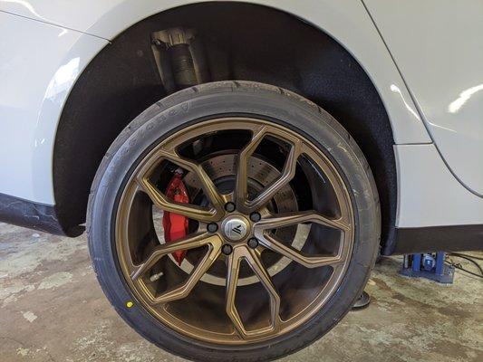 Adjusting suspension and camber settings on a Maserati Ghibli