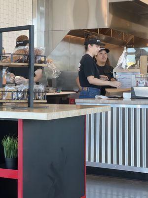 The mgr. Samantha and crew giving the best & nicest service while making some awesome sandwiches!