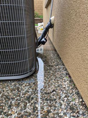 Flooding near my AC unit. They did a poor grading job, and they even blocked off one of my drains.