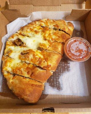 Pepperoni and sausage calzone.