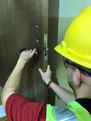 The Flying Locksmiths of Seattle talented Locksmith Technician installing electrified access control locks.