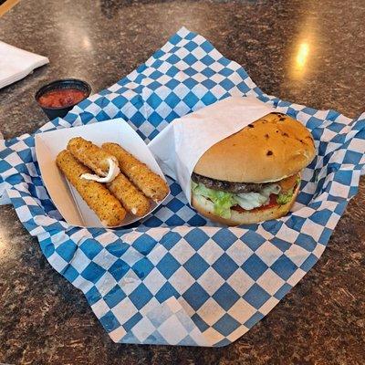 Mozzarella sticks and a cheese stuffed burger