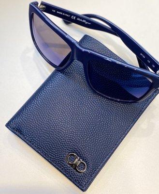 Don't Be Blue, it's Salvatore Ferragamo. Men's Signature Logo Wallet Paired With Matching Blue Frame & Blue Lens Sunglasses.