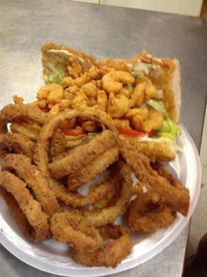 Shrimp Poboy with hand battered onion rings. Devine!