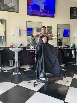 That's my boy getting his hair chopped just before he starts sixth grade.  I'm next!