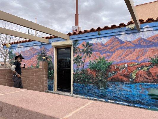 Some of the mural on the west side of the building.