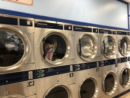 Coin operated dryers.  25 cents for 6-minutes.  Regular washing machines are $2.50 a load.