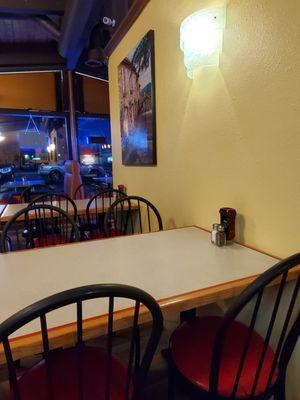 Clean dining room with booths and tables.