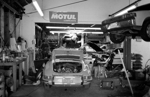 the shop with some customer's cars being attended to.