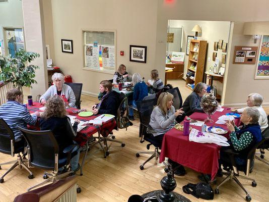 The Green Spot volunteers enjoying a well-deserved pizza party after the holidays.