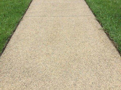 Walkways are rubber / rock composite. Very comfy to walk on.