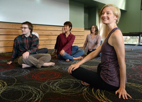 Seated twist during a 30 minute office yoga class