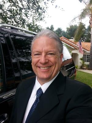 Jon Gordon, owner of Ojai Limousine in front of his 7 passenger Lincoln Navigator.