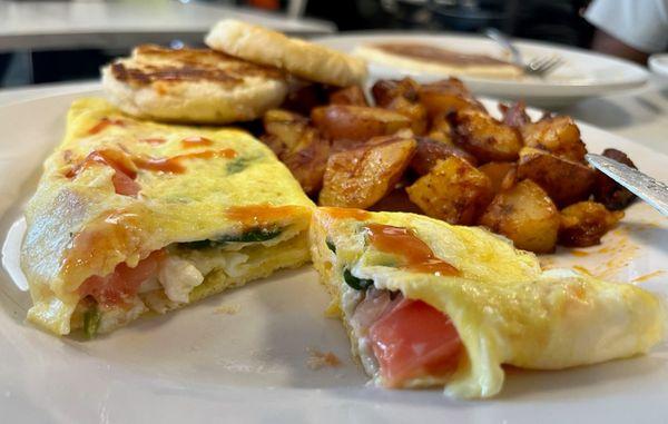 Small omelet, potatoes and biscuit.