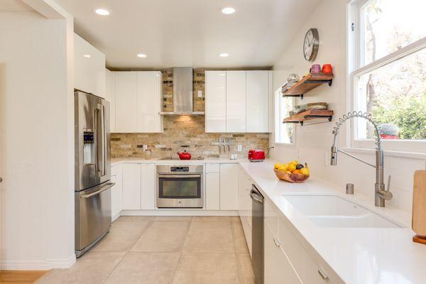 A custom kitchen remodel by the GoodFellas Construction team! We used a custom brick backsplash and and beautiful cabinets.