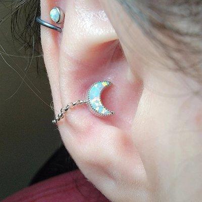 Super pretty white opal moon in solid 14k white gold with a white gold chain in a conch piercing by Melini