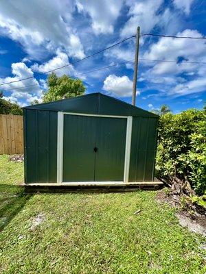 Wood base assembly and 10' x 8.5' metal shed above