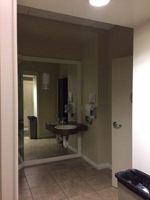 Posh restroom and hand washing accommodations in the waiting room and personal locker room area of the women's breast health department.