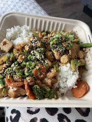 Stir fry with tofu, chicken, 4 veggies (broccoli, carrots, baby corn, and snap peas), with white rice! I asked for light sauce.