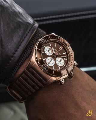 The boldest of all BREITLING Chronomat with a brown dial and a luxury 18k red gold case.