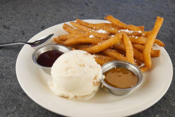 Deditos con nieve, warm funnel fries served with coconut ice cream and raspberry and caramel sauce. An amazing ending to a wonderful dinner!