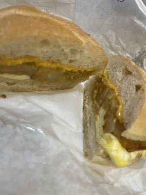 Egg cheese and potato on a roll