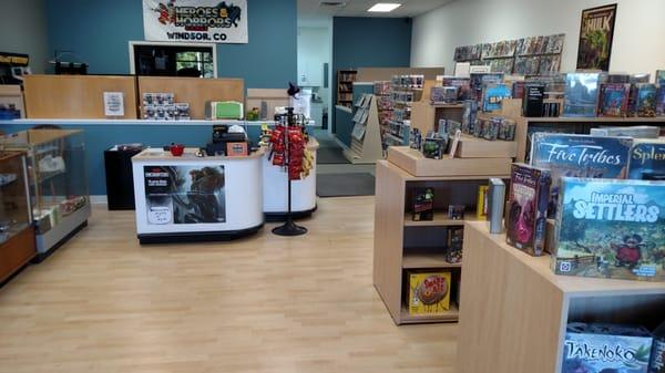 View as you walk in the door.  Games, comics & books to the right.  Collectible card games to the left.