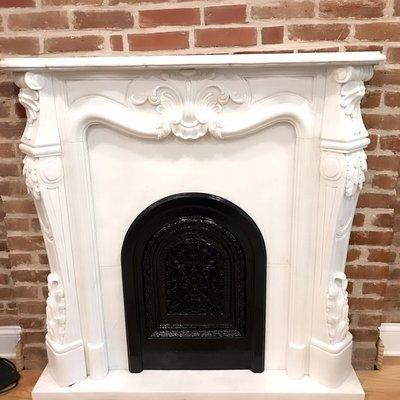 This beautiful Custom mantel with marble for a fireplace made by us.