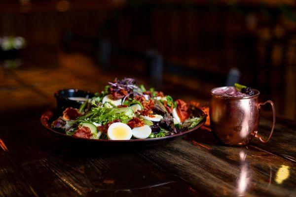 Norsemen Classic salad paired with Logi's Berry Smash signature cocktail