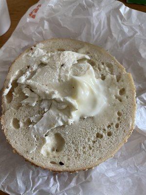 Bagel with globs of butter and cream cheese