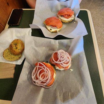 Spinach/kale bagel and two open face lox bagels.