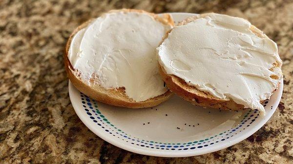 An everything bagel from Jeffs Bagel Run with cream cheese.