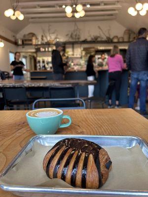 Oat milk, cappuccino, and chocolate croissant