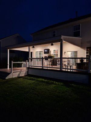 New railings, roof over new extended deck.