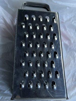 I purchased an old Cheese Grater for $5. I hope it  was someone's Grandma's to give me good luck cooking in the kitchen @ Merry Go Round