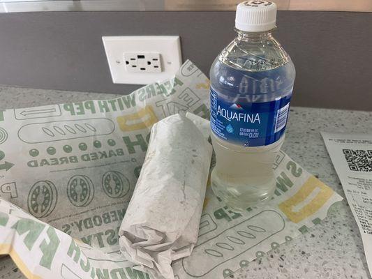 Tuna salad wrap and bottled water that added up to 17 dollars