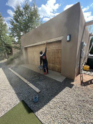 Sanding garage door.