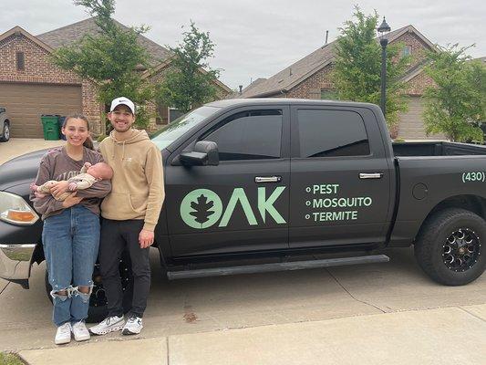 owner in front of company truck