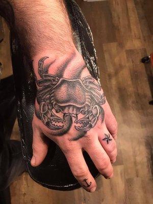 A recent hand tattoo done by our artist Maegan