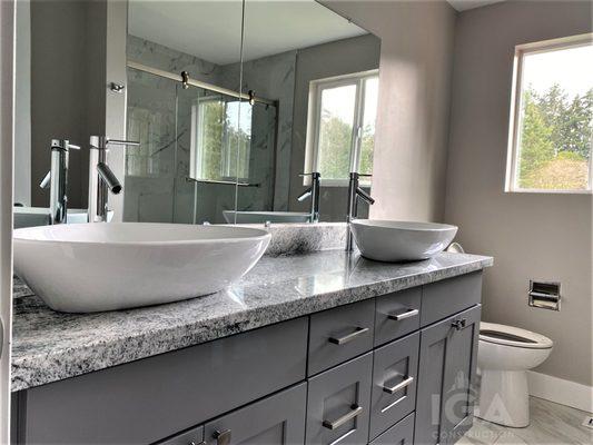 Grey Shaker Vanity with vessel sinks on viscount white granite.