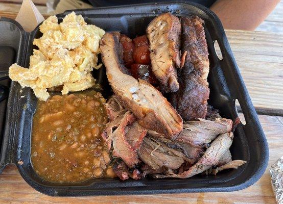 Top left Mac and cheese, hot link, pork ribs, baked beans, brisket