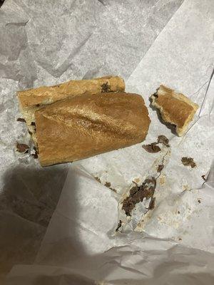 Half eaten steak and cheese