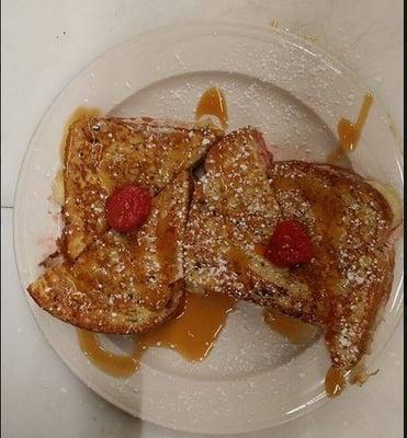 Stuffed French Toast: Stuffed with cream cheese blend, strawberries, banana's and topped with drizzled caramel.