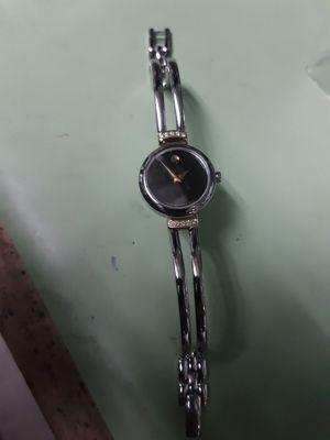 Ladies Movado for link repairs and refinish.