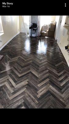 Herringbone pattern tile flooring.