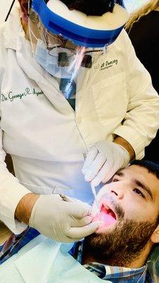 Dr. Ayoub installing a new crown to one of his patients!