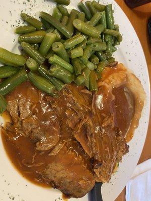 Brisket with mashed potatoes and green beans. Just like the picture.