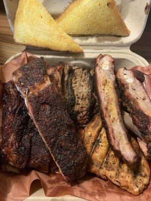 Austin combo. Ribs, chicken, brisket. Dry rub ribs