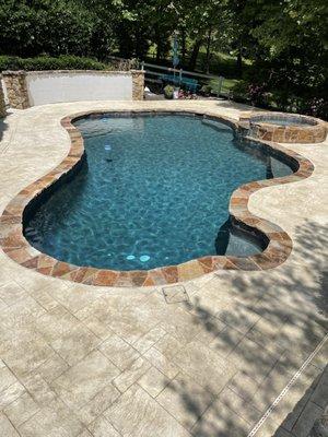 stamped concrete pool deck installed by metric concrete